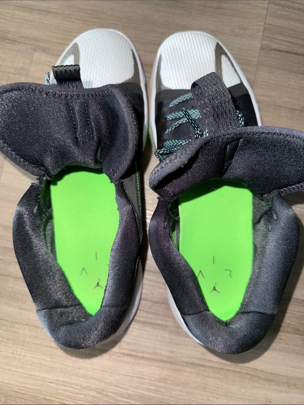 Jordan Black High-Top Sneaker with Green Jumpman and Multicolor Sole